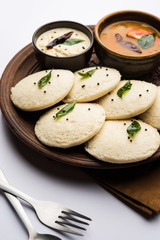 Idli Sambhar or Idly Sambar is a popular south Indian food, served with coconut chutney. selective focus