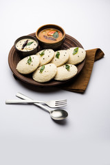 Idli Sambhar or Idly Sambar is a popular south Indian food, served with coconut chutney. selective focus