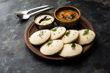 Idli Sambhar or Idly Sambar is a popular south Indian food, served with coconut chutney. selective focus