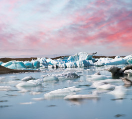Fototapeta na wymiar Blurred long exposure view of Icebergs moving in Jokulsarlon Lagoon, Iceland