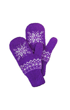 pair of pink lilac purple knitted mittens with christmas pattern isolated on