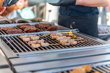 Grilling shrimps on the barbecue in a restaurant during a wedding