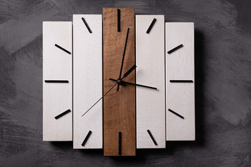 wall wooden clock at gray background texture