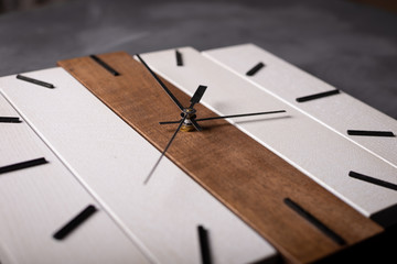 wall wooden clock at gray background texture