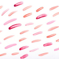 Nail polish strokes pattern background in nude pink, peach, red colors. Abstract paint blots background for beauty and fashion, copy space