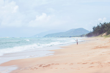 Fisherman on Beach in Sanya, Chinese island of Hainan, South China sea