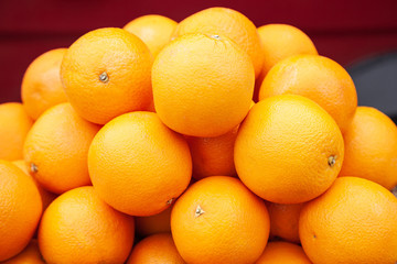 Oranges on market stall. Bunch of bright color oranges. Texture background ripe juicy fruits oranges. Product Image Tropical Oranges Fruit