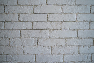 A wall of white bricks.