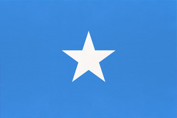 Somalia national fabric flag, textile background. Symbol of world african country. - obrazy, fototapety, plakaty