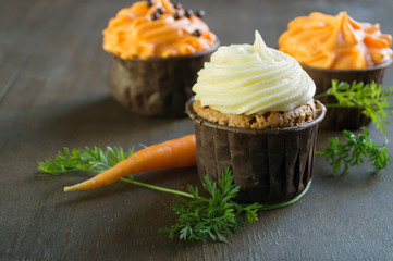 Lush homemade carrot cupcakes with cream.
