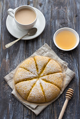 Freshly baked carrot scones with cream on wooden table. delicious homemade cakes. top view