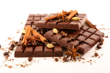 chocolate bar with cinnamon and anise isolated on white background