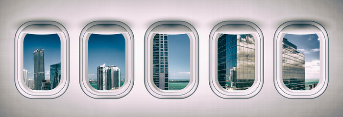 Airplane interior with window view of Miami, USA. Concept of travel and air transportation