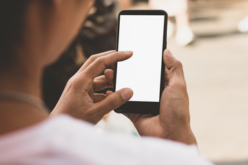 A smartphone with an empty screen in a man's hand, mockup phone.