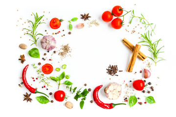 Tomatoes and chili peppers with herbs and spice scattered