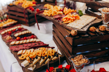 Luxury food and drinks on corporate party table.