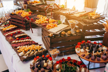 Luxury food and drinks on corporate party table.
