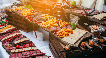 Luxury food and drinks on corporate party table.