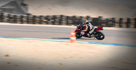 motorcycle racer rides on a sports track