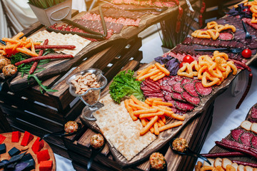 Luxury food and drinks on corporate party table.
