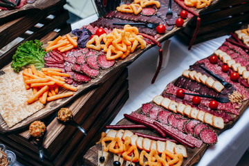 Luxury food and drinks on corporate party table.