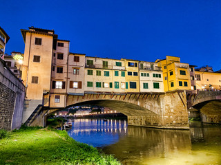 Obraz na płótnie Canvas Old Bridge and Florence Lungarni at night. Panoramic cityscape in Autumn, Tuscany - Italy