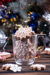 Gingerbread cookies snowflake shape in glass. Christmas New Year decorations.