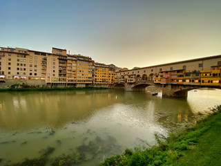 Fototapeta premium Old Bridge and Florence Lungarni at dusk, Italy
