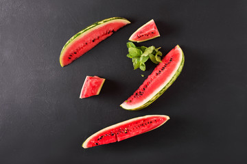 Slices of watermelon. Sliced watermelon on a black background.
