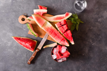 Slices of watermelon. A cut watermelon on a gray background. Watermelon smoothies ingredients