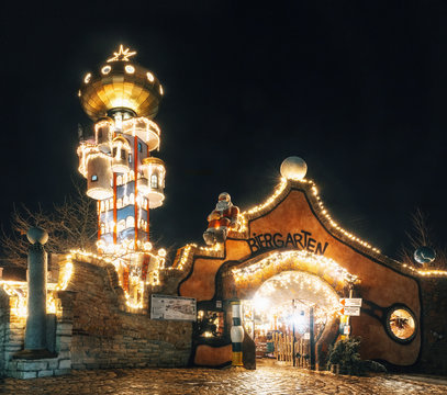The tower of Kuchlbauers Beer World with Christmas illuminations and loads of shining decoration merchandise. Abensberg, Germany