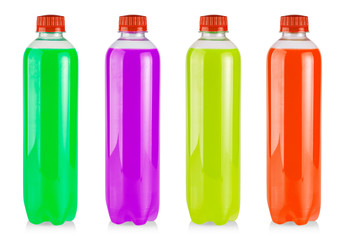 The plastic bottles with colored juice on white