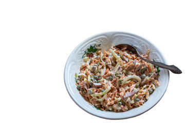 Dish with cooked salad of vegetables, root vegetables and sauce, ready to serve, close-up, copy space, isolated.