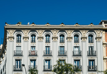Antique building classic colored facades in Madrid city center. Spain