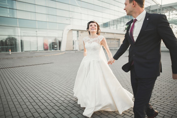 Fototapeta premium Luxury married wedding couple, bride and groom posing in old city