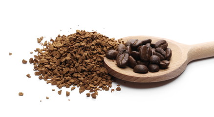 Instant coffee granules and beans with wooden spoon, isolated on white background