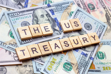 The words US Treasury on dollar usa background.