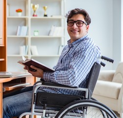 The disabled student studying at home on wheelchair