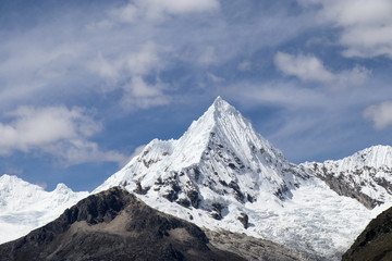 Peru - Hiking around Huaraz to laguna 69 and lake paron in the andes - turquoise blue lakes with snow capped mountains surrounding creating stunning scenery