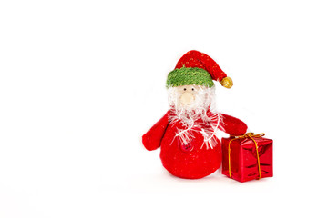 New year, Christmas, toy Santa with a gift close-up isolated on a white background