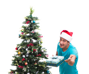 Young man decorating christmas tree isolated on white