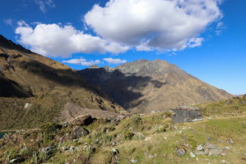 Fototapeta premium Peru - Salkantay trek - stunning mountain scenery along the route - 4600m high point surrounded by rocky greenery and blue skies