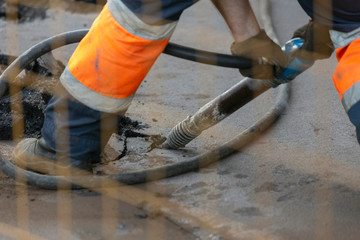 Cutting asphalt for repair with a hammer. road works; horizontal orientation