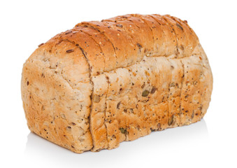 Fresh loaf of seeded brown bread on white background. Traditional bakery heritage.