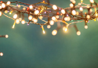 holiday banner of Christmas lights on blue background