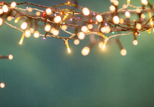 holiday banner of Christmas lights on blue background