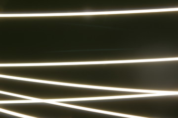 Abstract colorful irregular lines on black / green background photo with long exposure . Light painting photography. Lights with irregular patterns for overlay