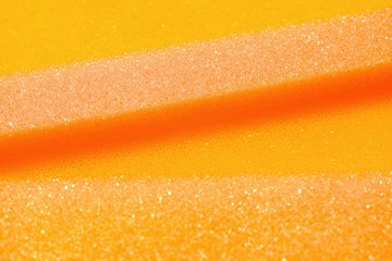 White and Pink artificial foam, foam texture on a light background.