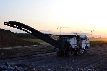 Cold milling machines are used for the quick, highly efficient removal of asphalt and concrete pavements. Removing and grinding the road surface, road construction and road rehabilitation - Image