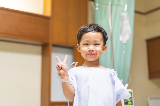 The patient boy is happy in the hospital, He has a cheerful heart.